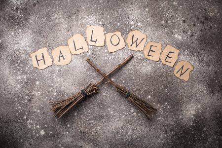 Halloween background with witches broom